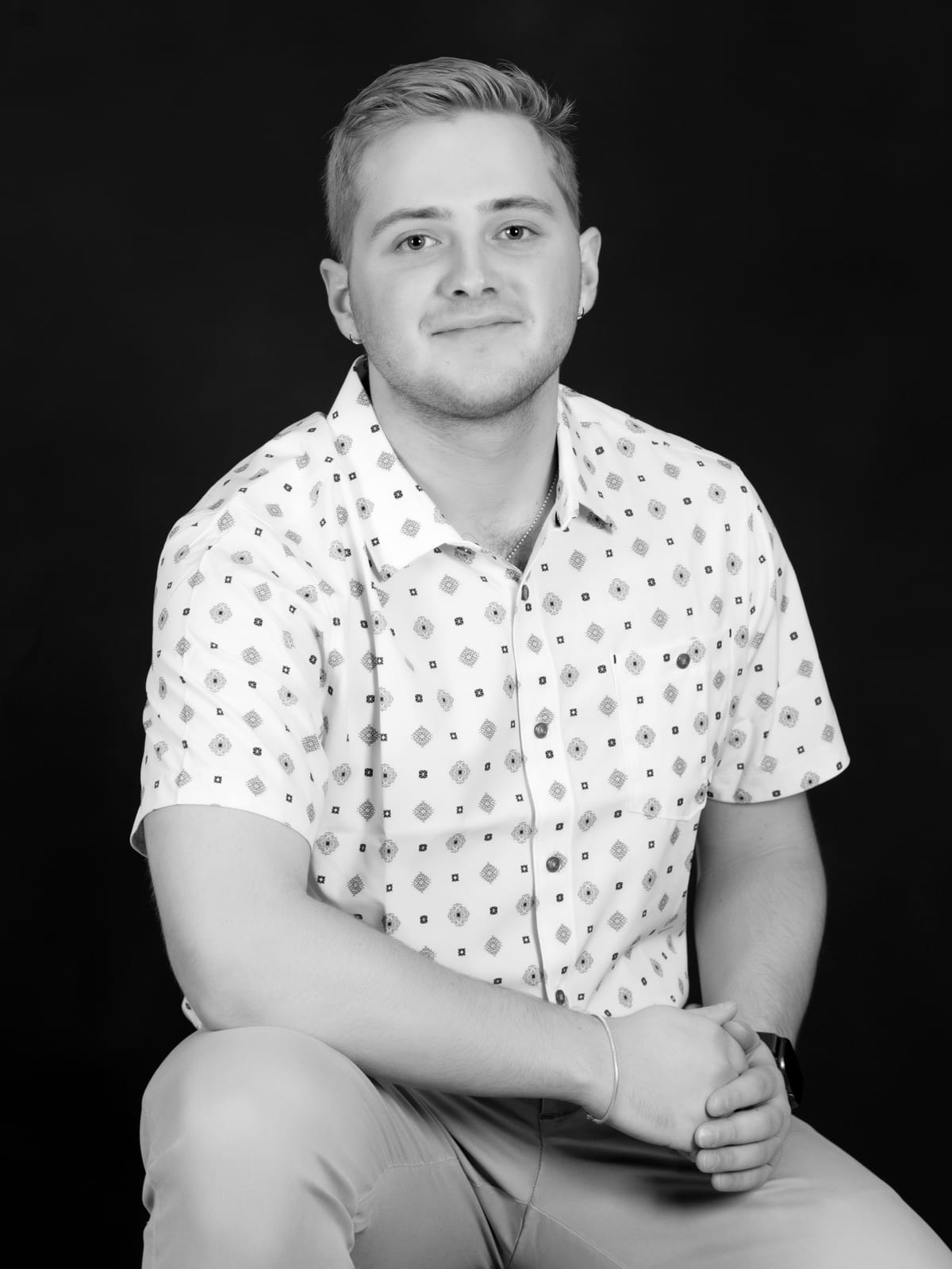 Kynan O’Brien photographed in a black and white studio portrait